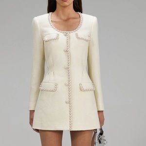 $660  SELF-PORTRAIT
Crystal-embellished ribbed knitted mini dress us 4 s…